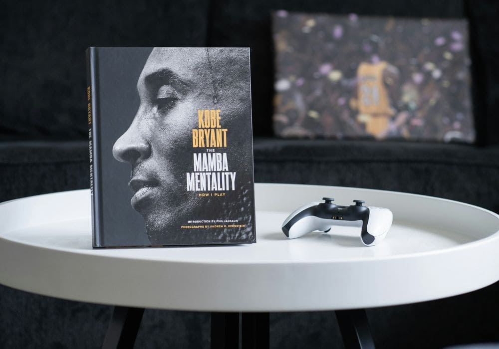 Kobe Bryant book “The Mamba Mentality” on a table symbolizing discipline, focus, and the principle of resting after finishing the work.